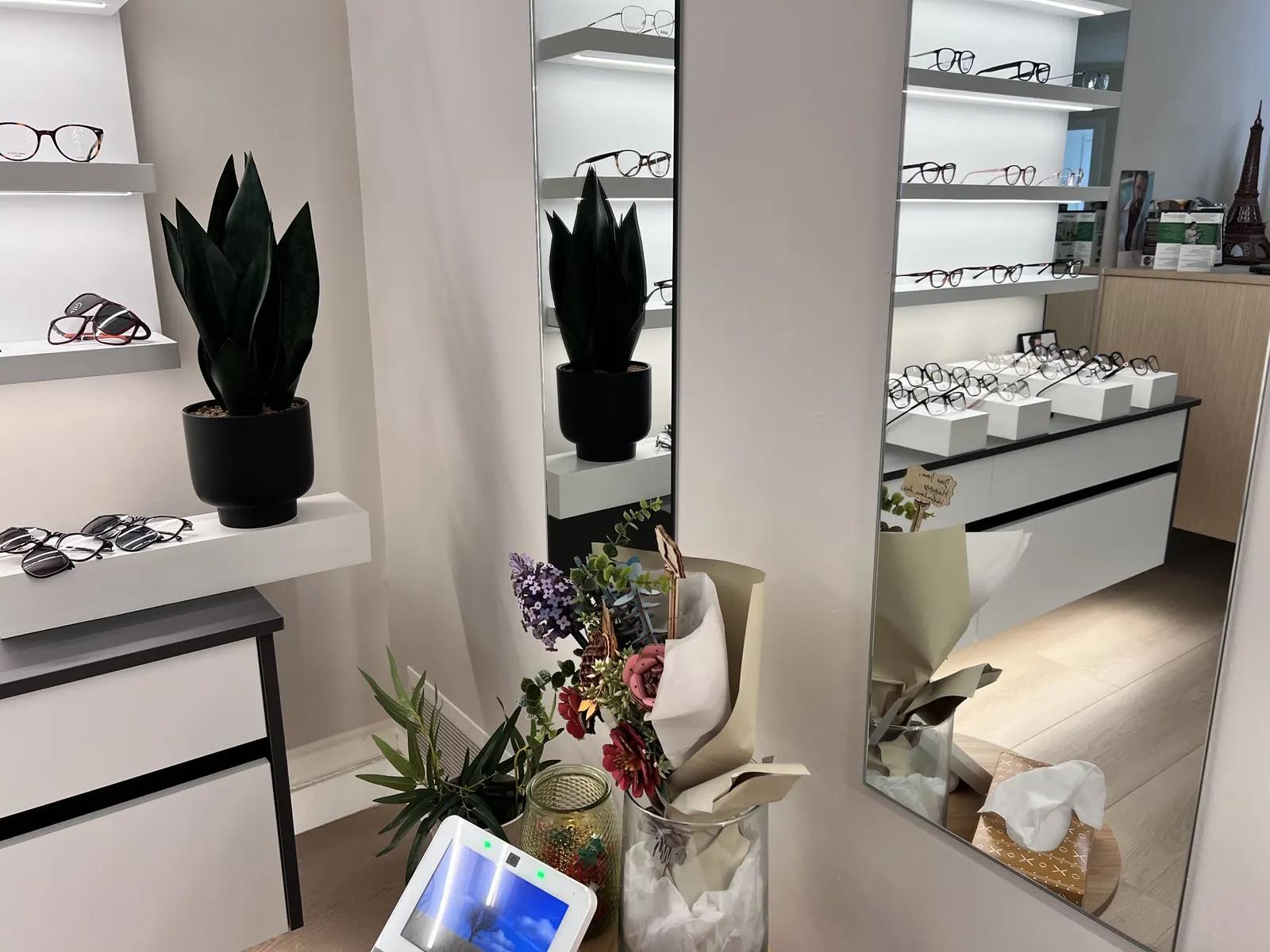 Backlit frame shelves and a full-length mirror in the Noor showroom